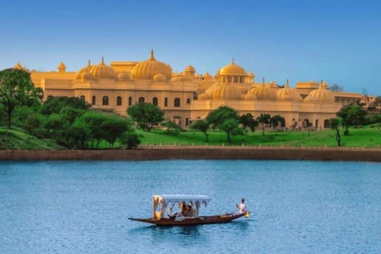 Rajasthan trip package featuring palace views and boat ride in Udaipur with private guides and palace country scenery