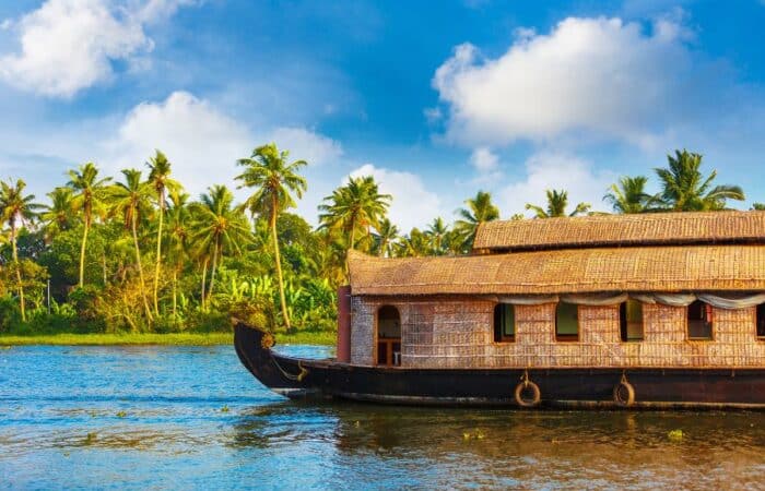 Kerala backwater trip with still waters, village life and coconut lined canals in a tailor-made Kerala escape