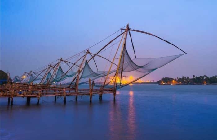 Kerala travel packages with private car, curated stays and scenic backwater experiences with backwaters, tea gardens and coastal scenery